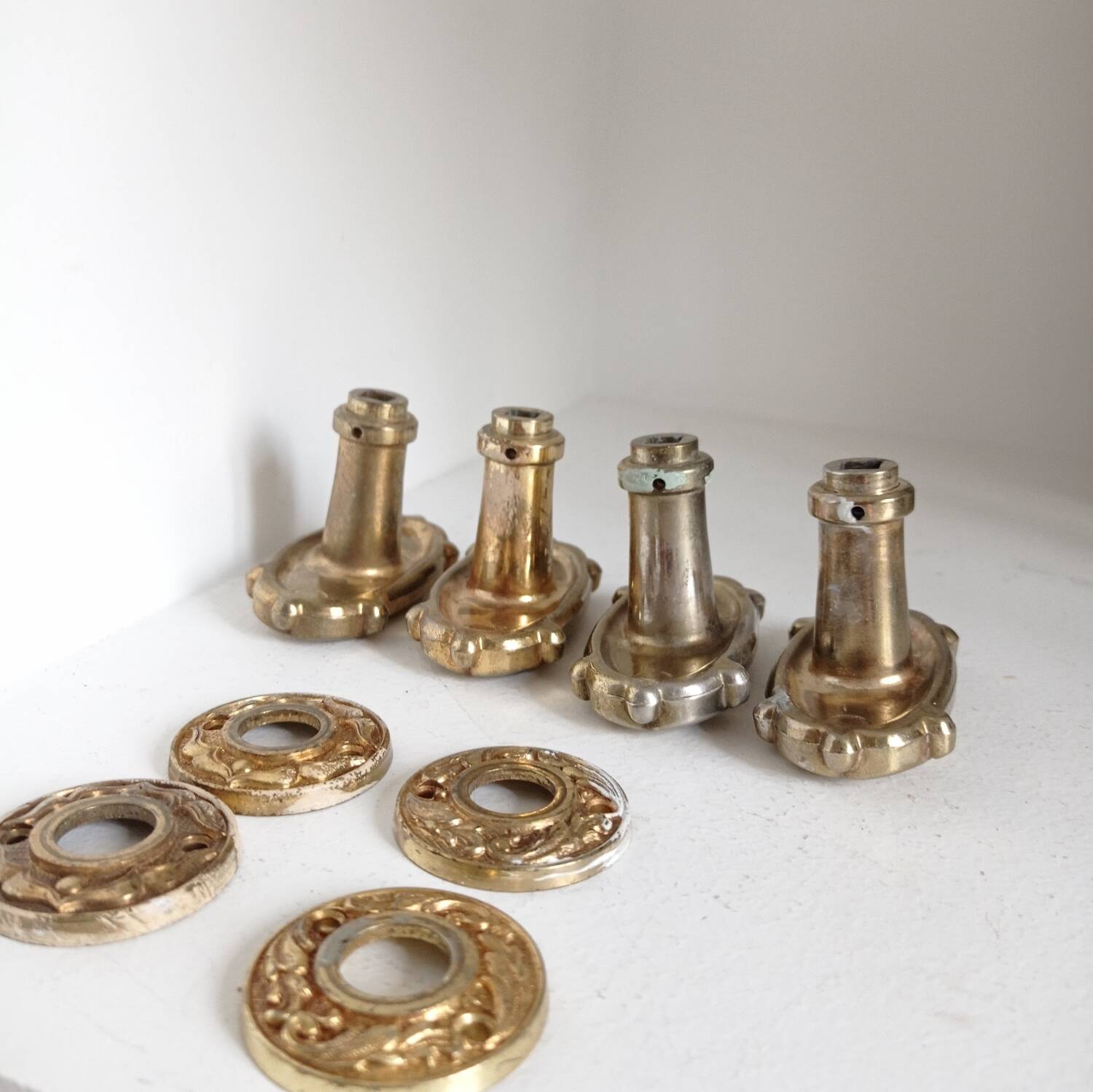 Gold door knobs and rosettes