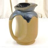 Vintage art deco water pitcher with drippy dark blue glaze.
