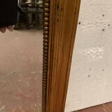 Miroir de style Louis XVI en bois et stuc doré XX siècle