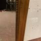 Louis XVI style mirror in wood and gilded stucco 20th century