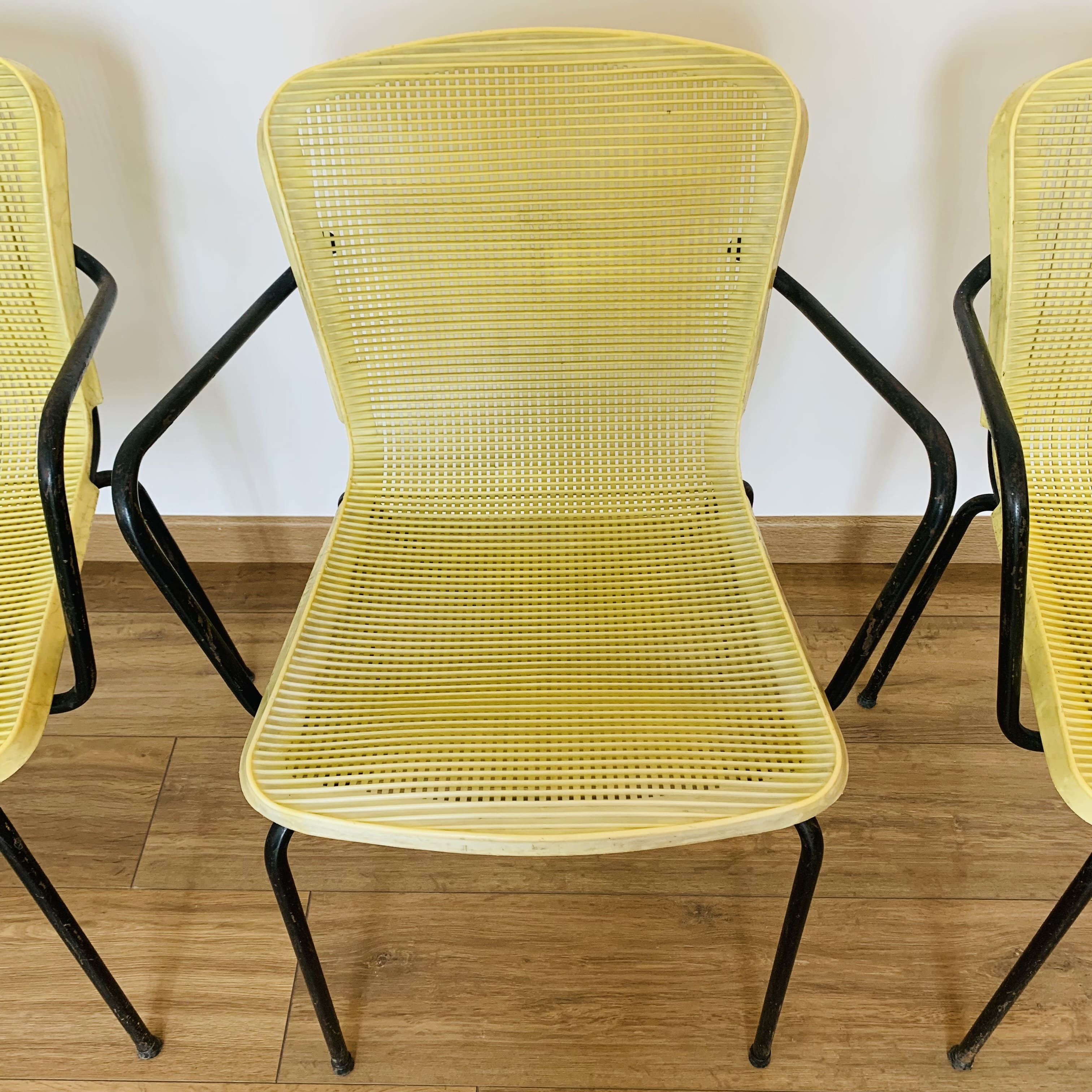 4 yellow outdoor armchairs