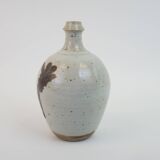 Stoneware bottle with abstract plant motif signed Herbes Folles