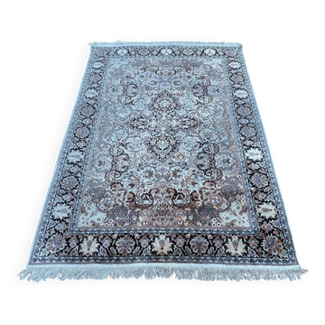 Hand-knotted Persian silk rug