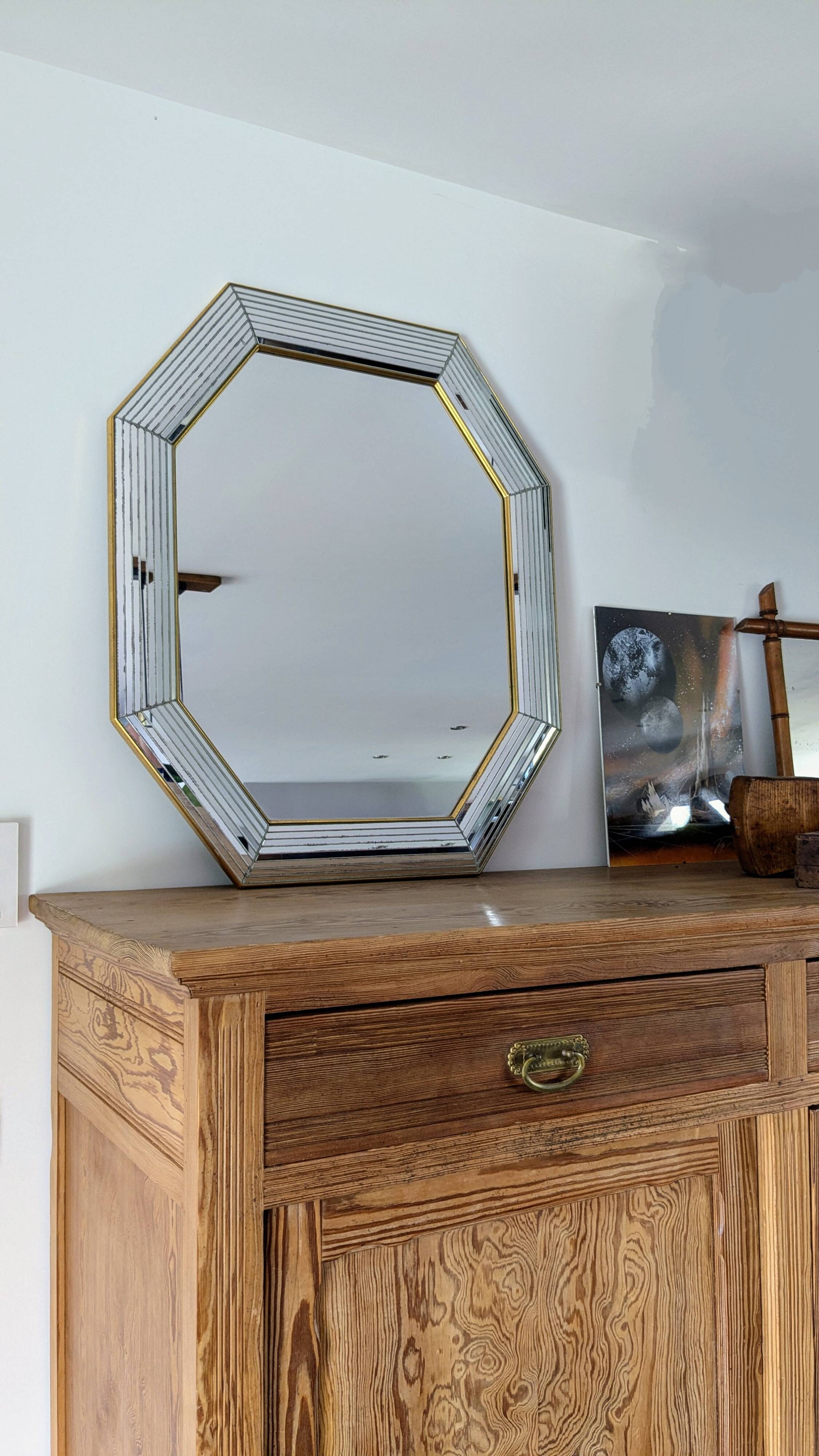 Octagonal mirror with brass parcloses by Jan Deknudt