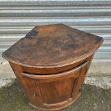 Small wooden corner accent table.