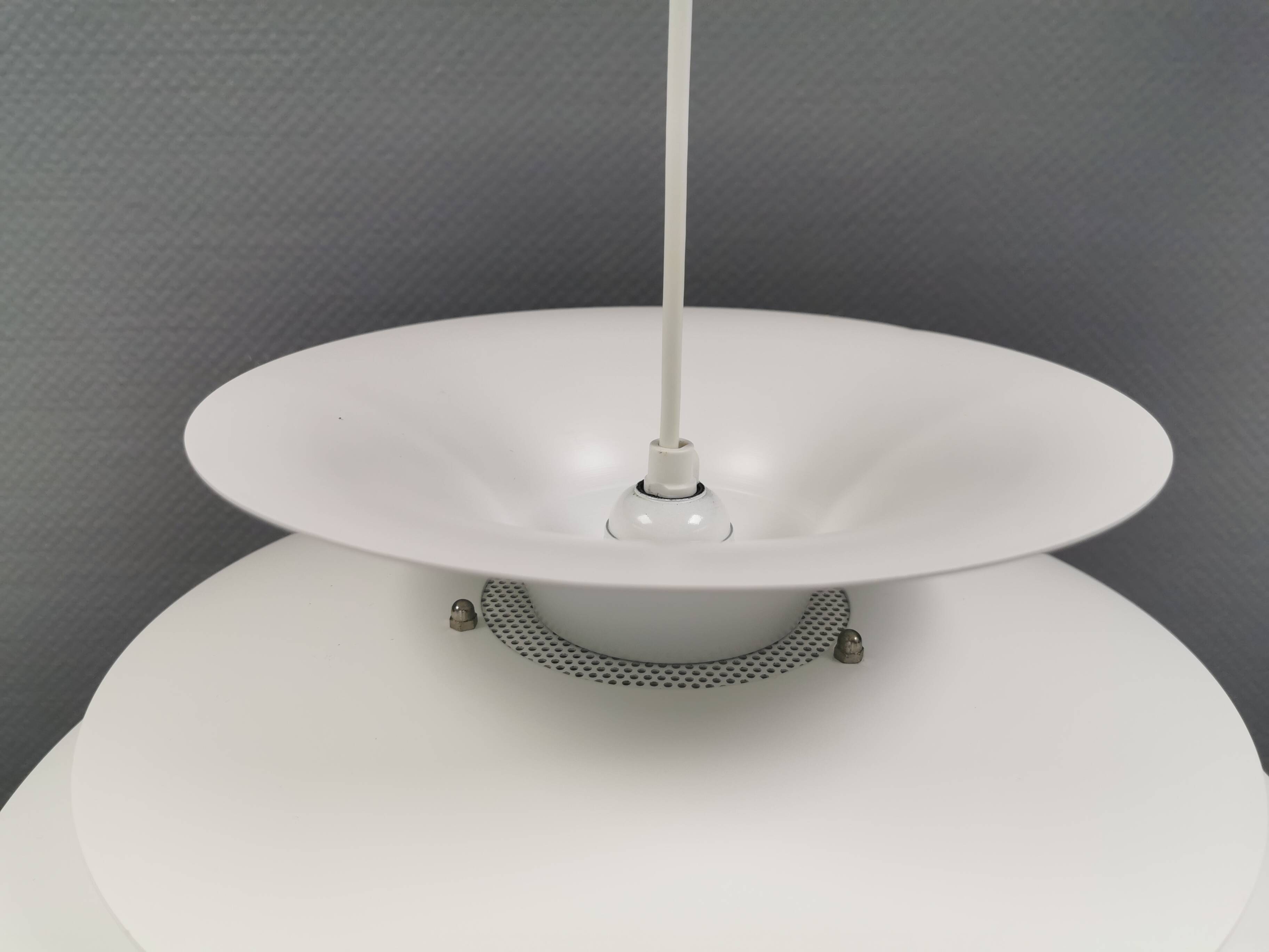 Hanging lamp with multiple layers of shades, by Junge/Vitrika