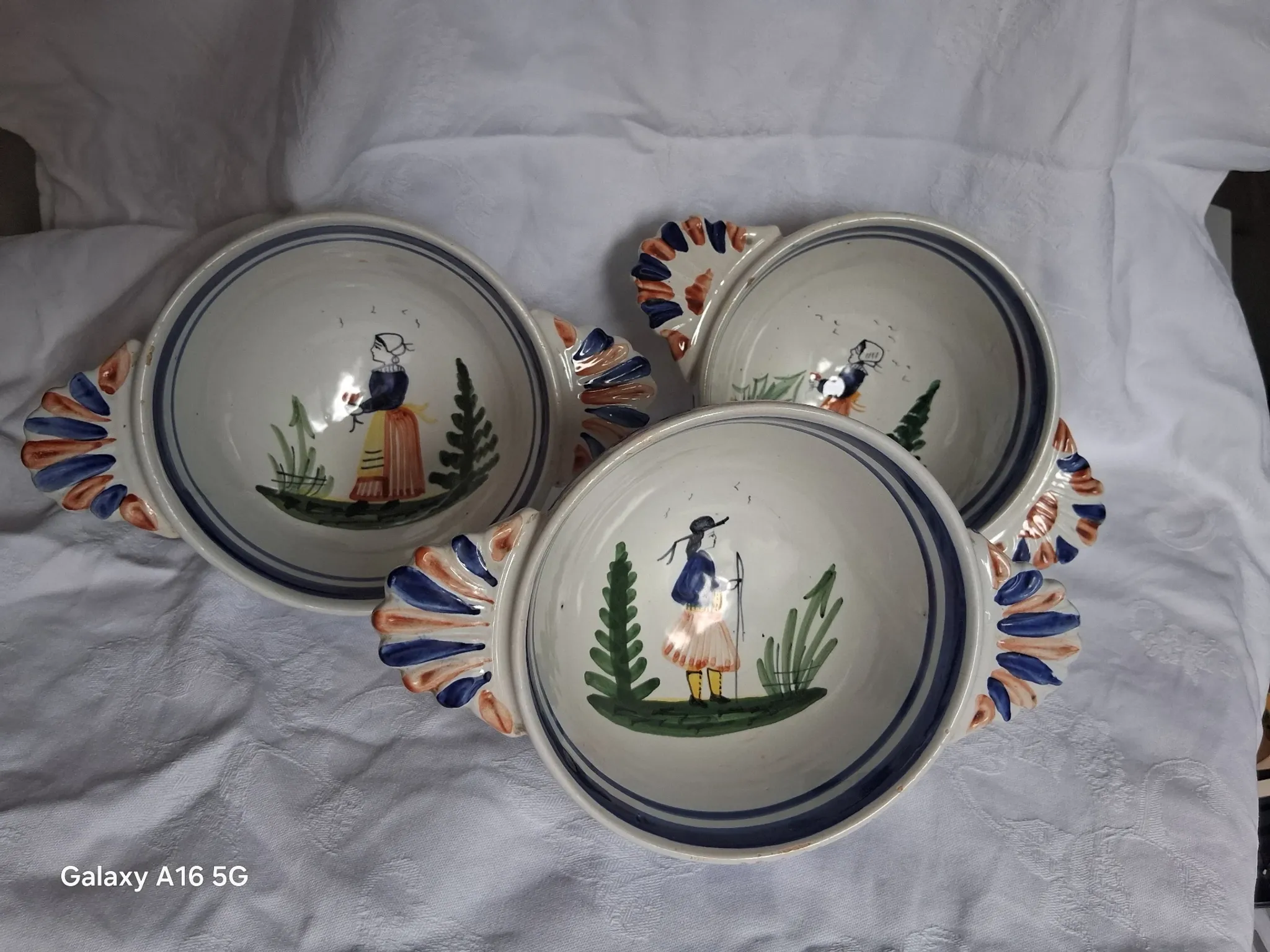 Set of three antique earthenware bowls from HB Quimper, signed.