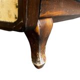 Vintage wooden armchair with rattan weaving.