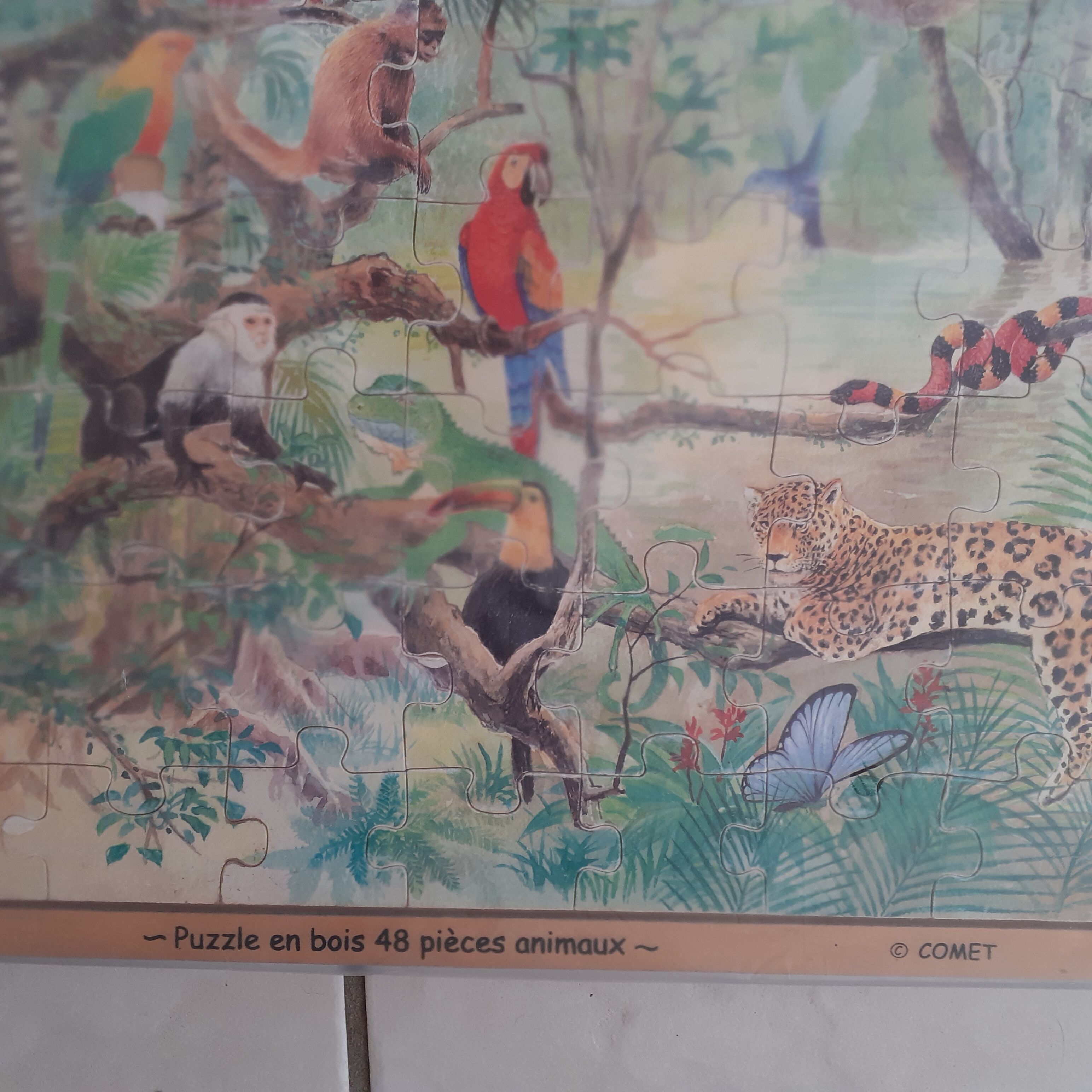 Wooden puzzle. Comet. Pattern jungle animals.