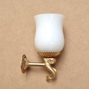 Pair of gold metal and opaque glass wall lights adorned with fish from the 1950s.
