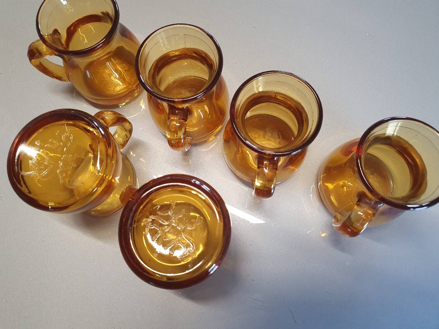 Set of original vintage small amber glass glasses.