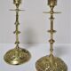 Pair of vintage brass candlesticks decorated with flowers