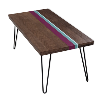 Solid oak coffee table with colored bands on pin legs