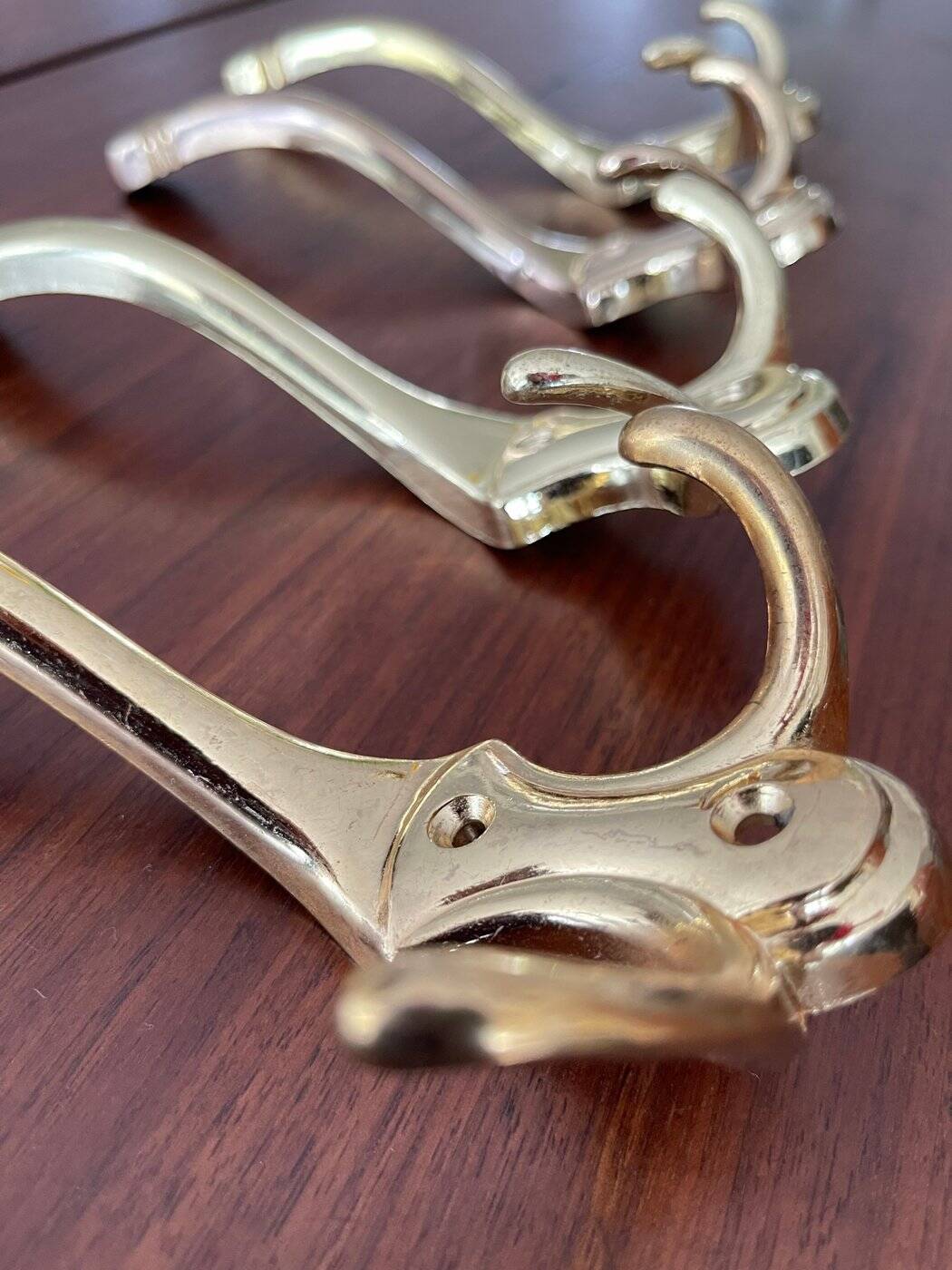 4 golden brass coat racks