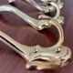 4 golden brass coat racks