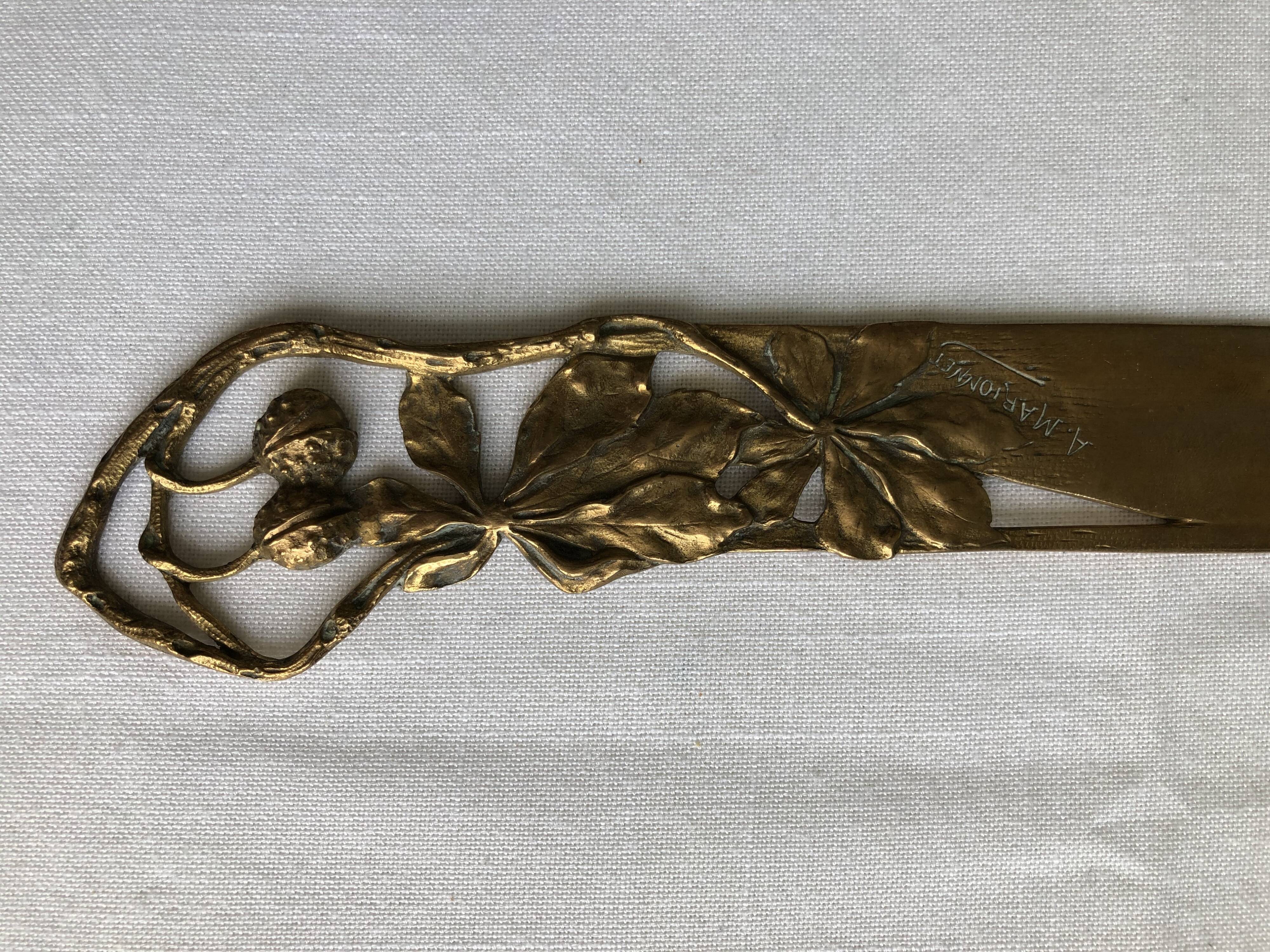 Opens carved bronze letters