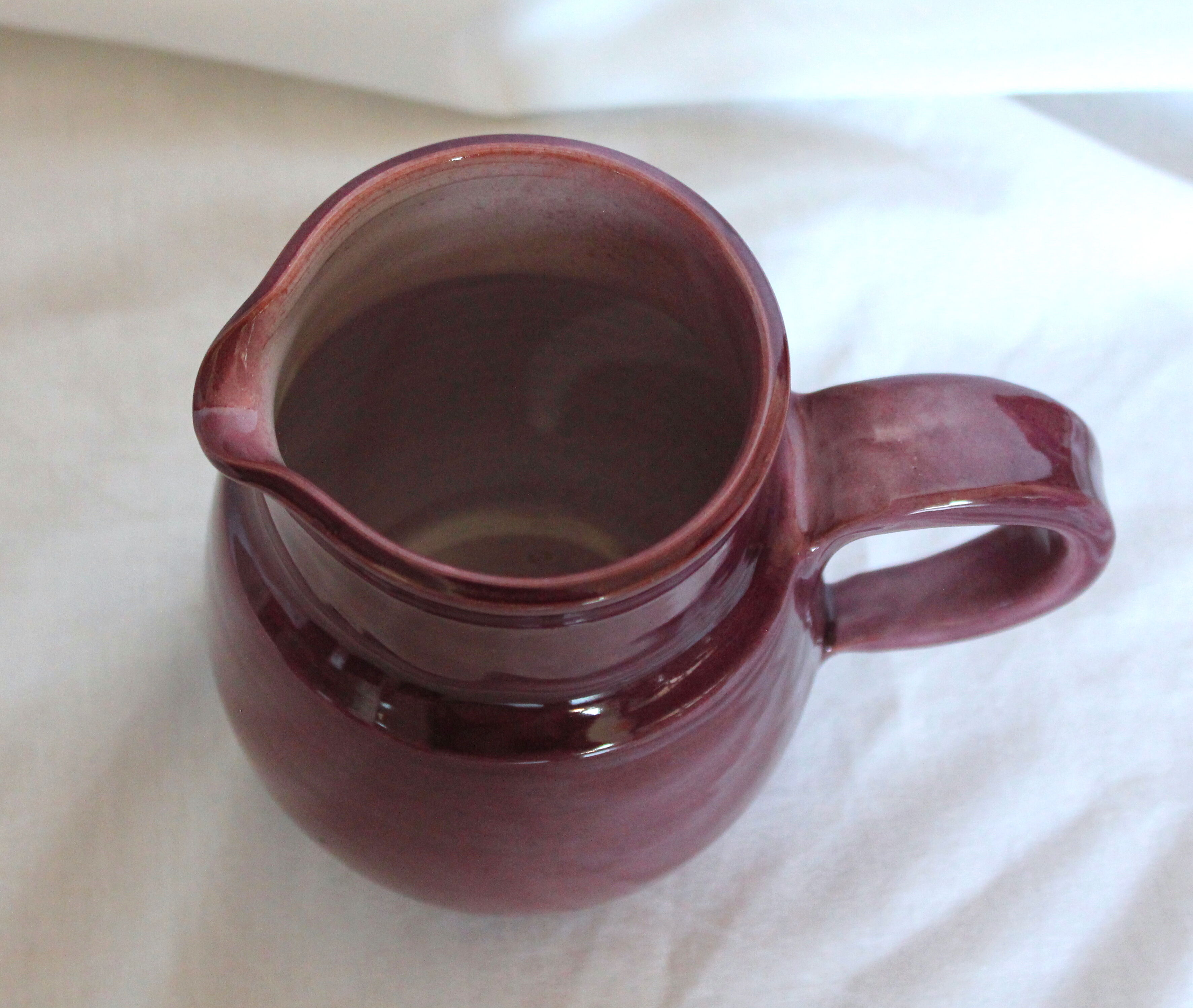 Purple ceramic pitcher and glasses set