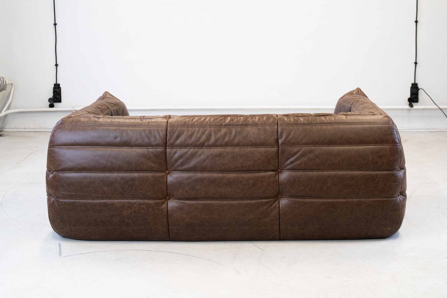 Vintage two-seater Togo sofa with arms in brown leather by Michel Ducaroy for Ligne Roset, 1970s