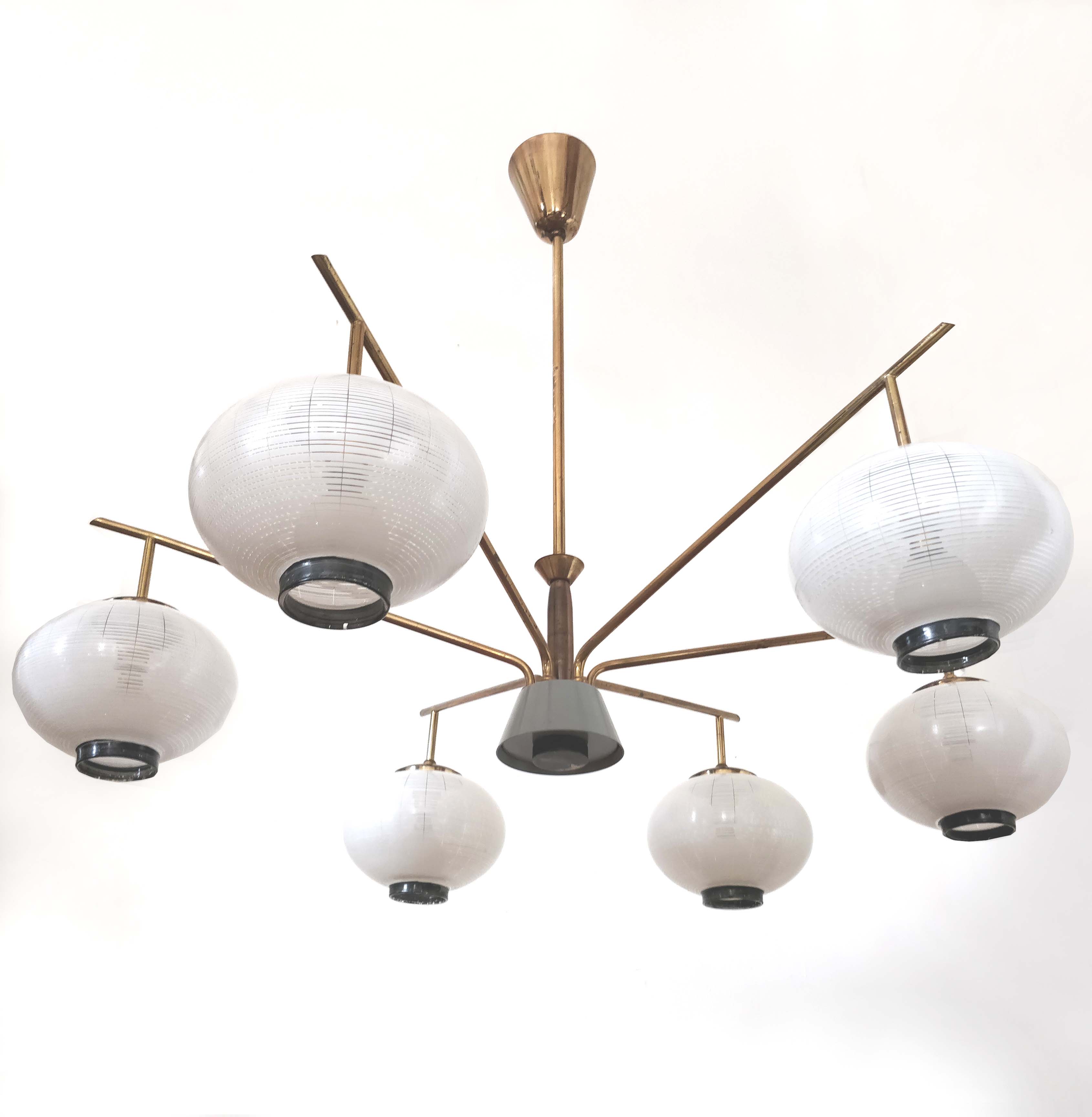 Brass chandelier and 6 white streaked glass globe lights