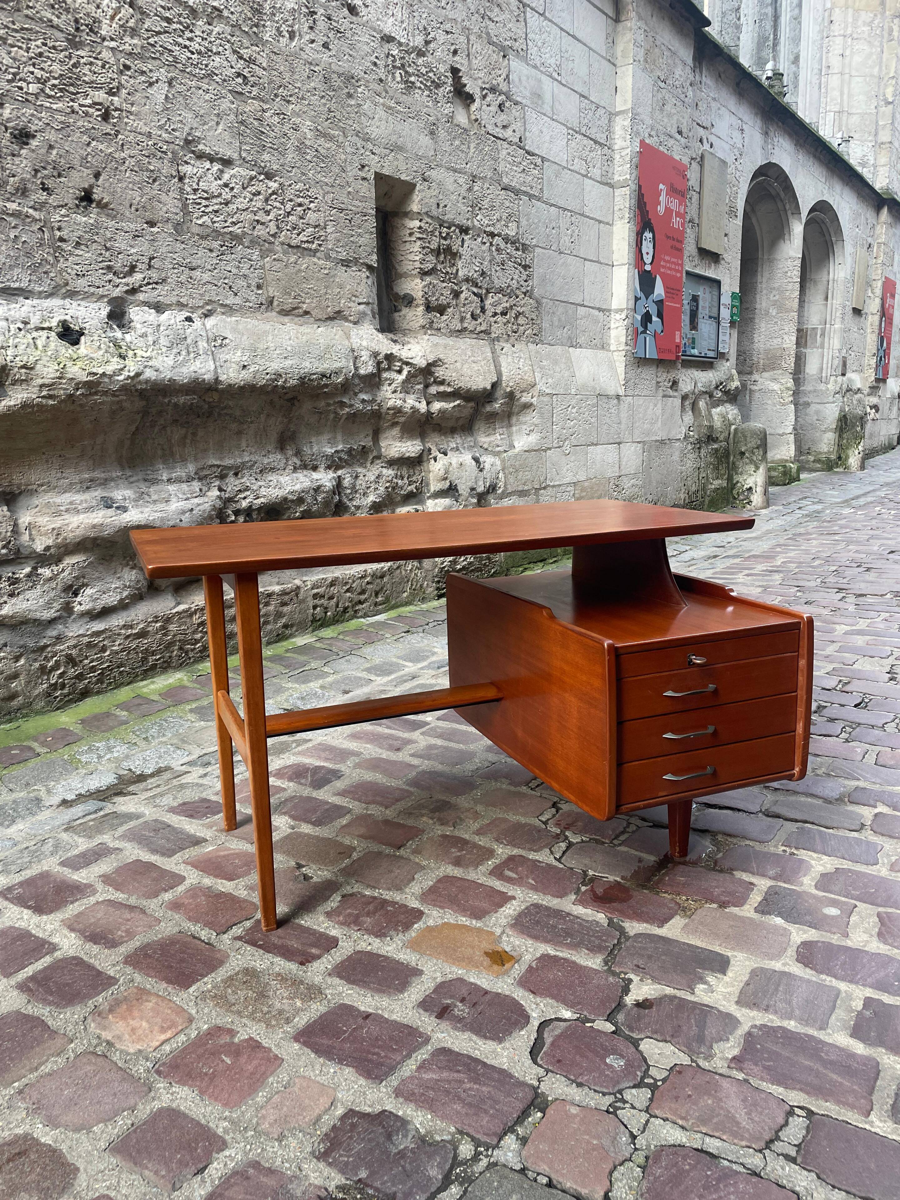 Mahogany desk with drawers by Jacques Hauville published by Bema.
