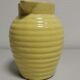 Yellow pitcher in slurry, faience onnaing frères