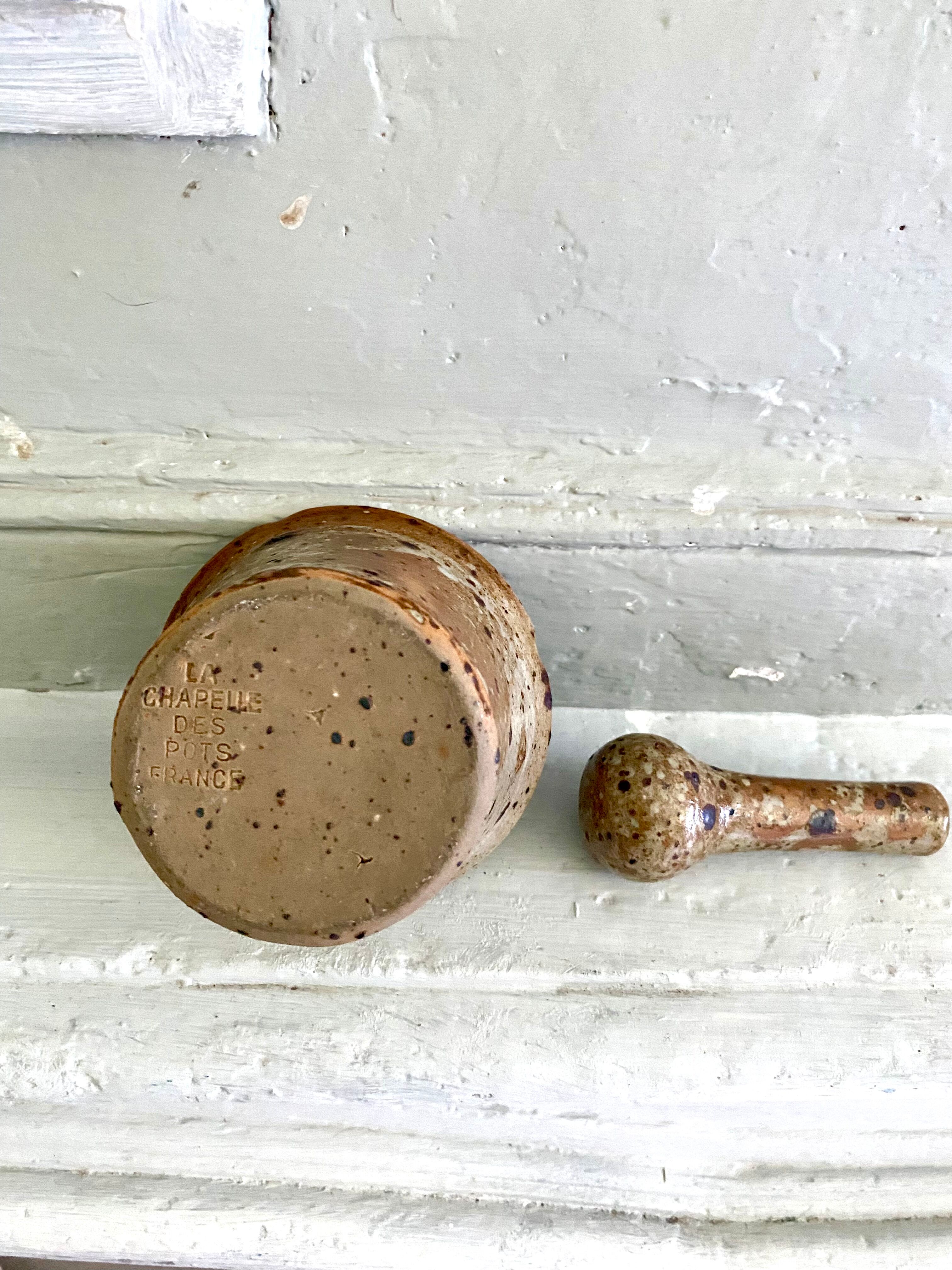 Pyrite sandstone mortar and its pestle
