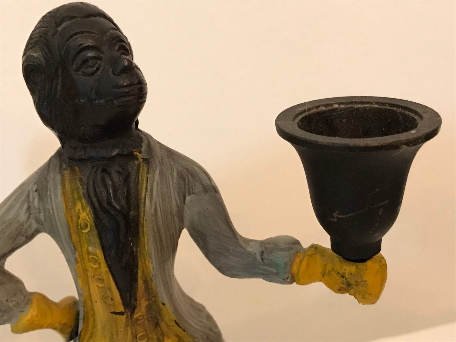 Cast iron servant monkey candle holder