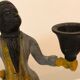 Cast iron servant monkey candle holder