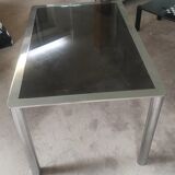 Dining table in chromed steel and smoked glass slab in 1969