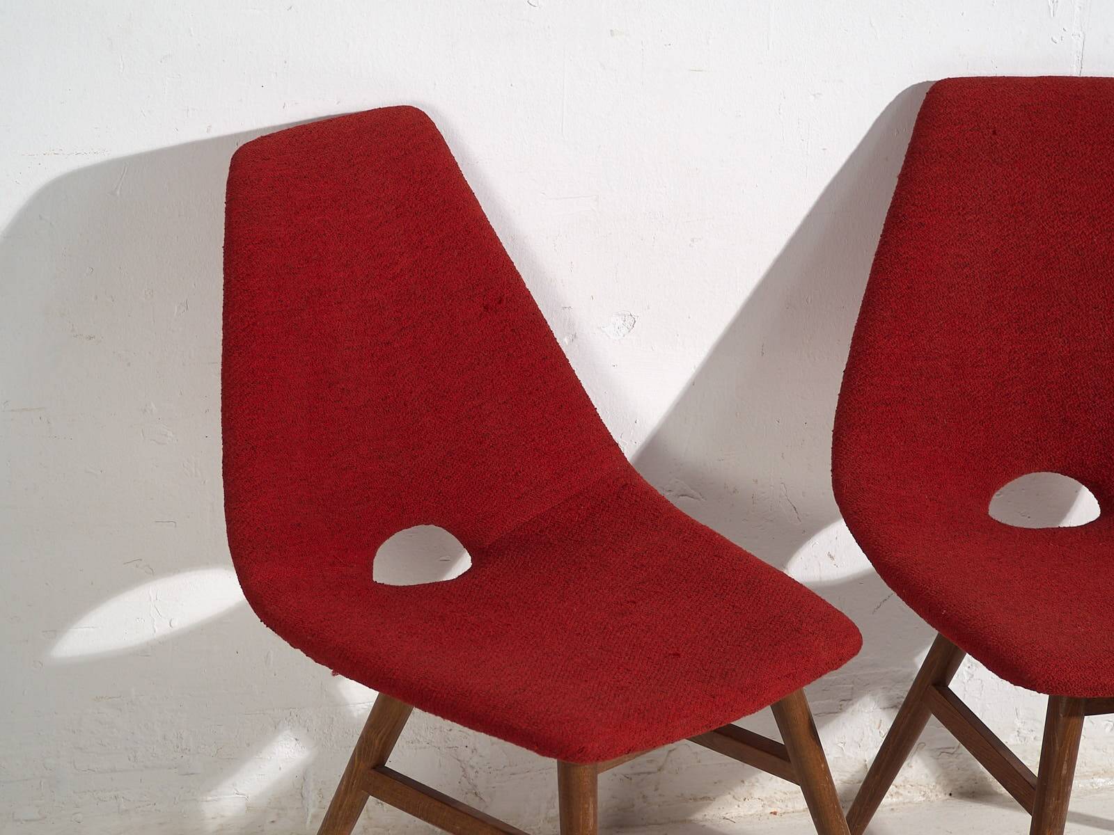 Wooden chairs with burgundy red fabric, circa 1950