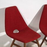 Wooden chairs with burgundy red fabric, circa 1950