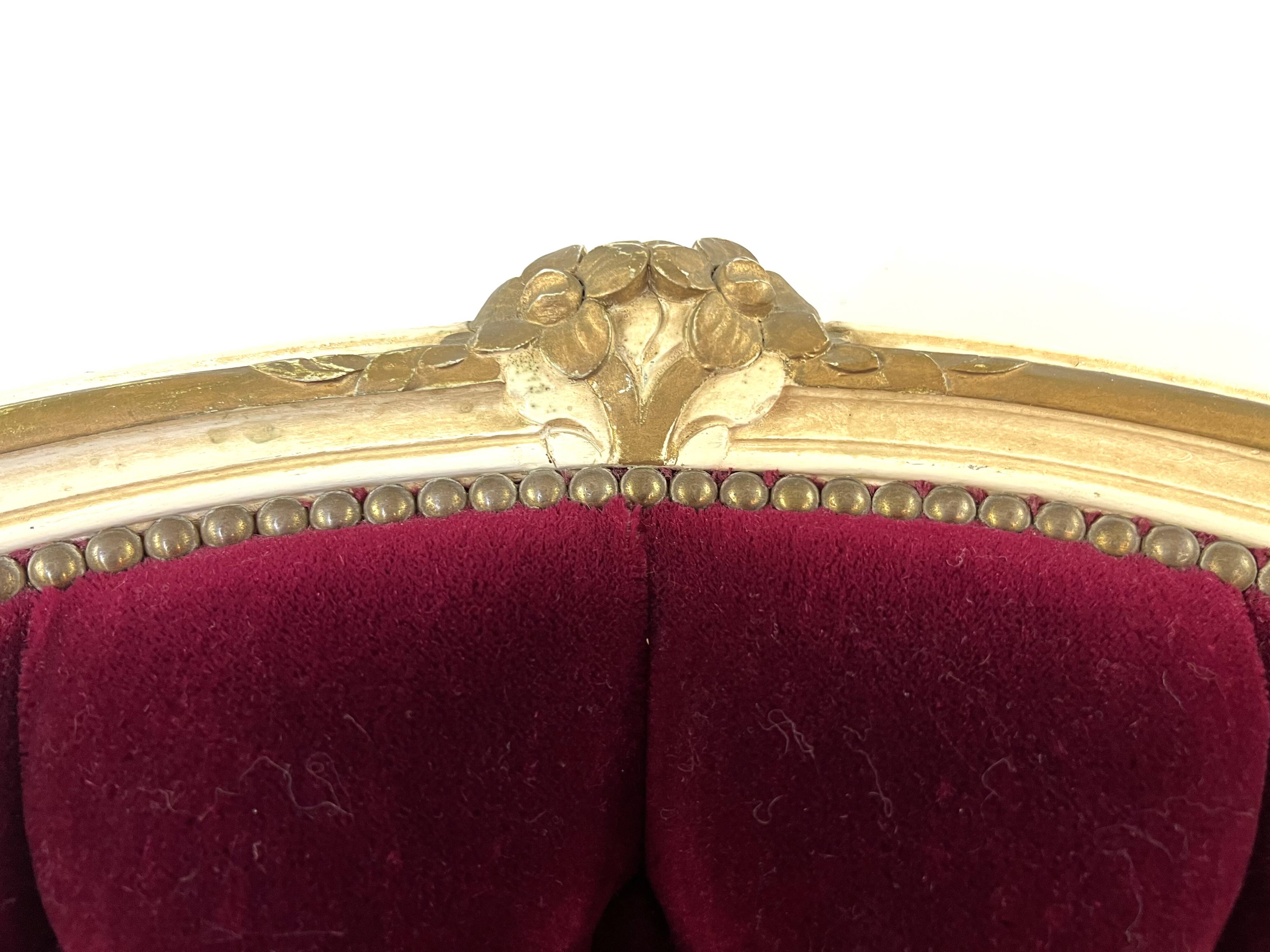 Louis XV armchair in gilded wood and garnet red velvet