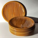 Ten plates in Salins slip with braided patterns 50s