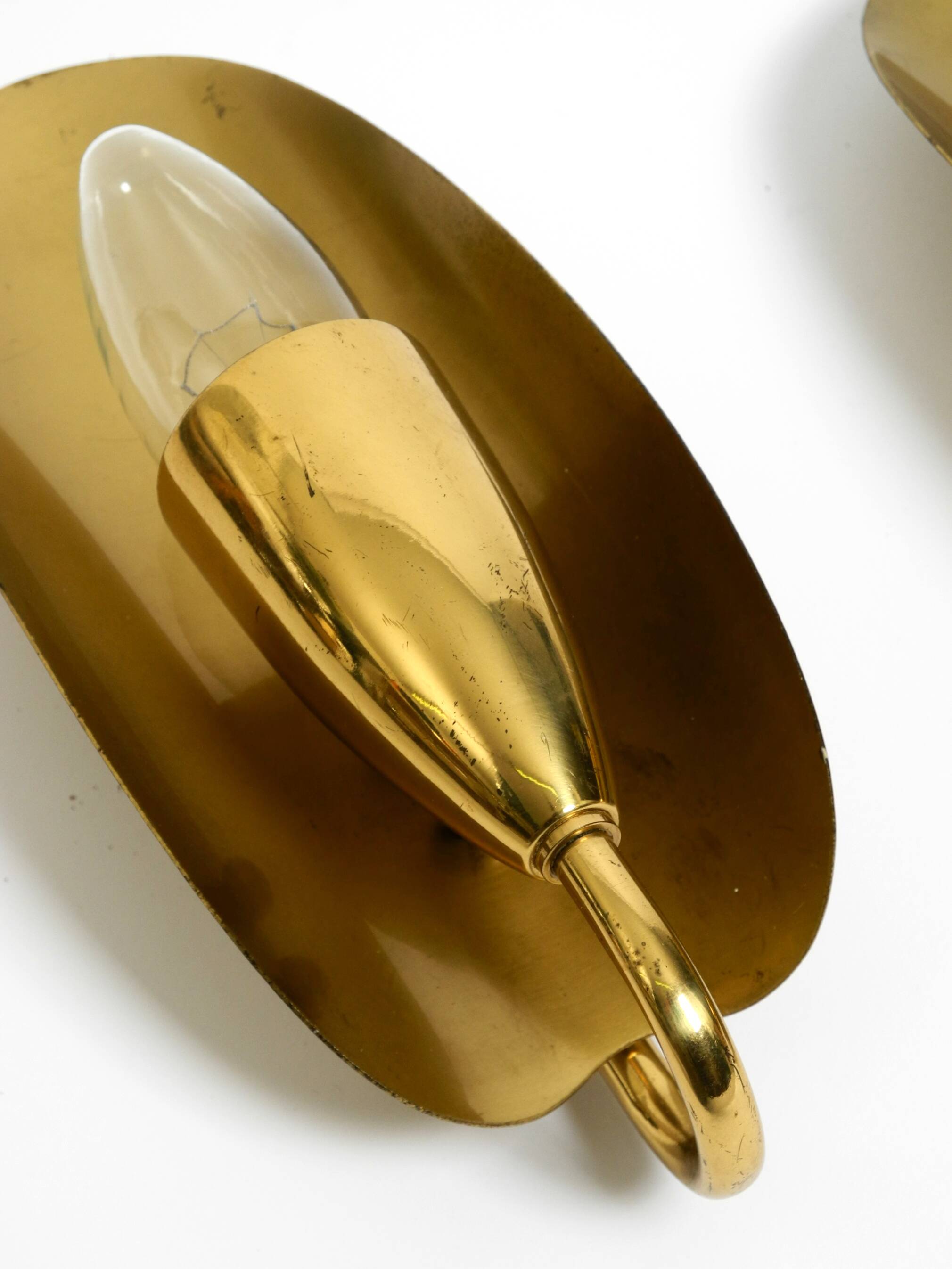 Two magical original Mid Century Modern bag brass wall lamps