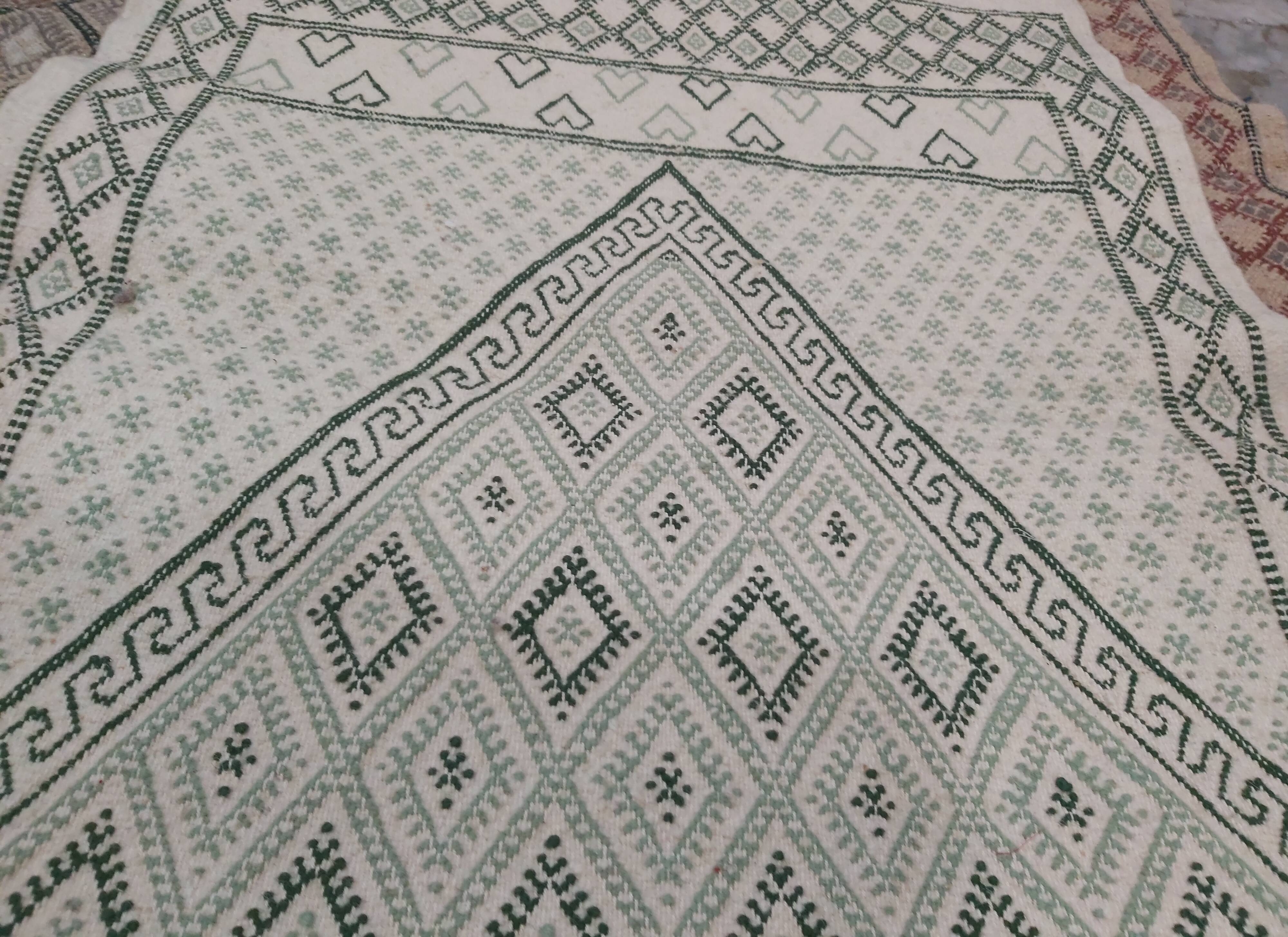 Traditional white and green carpet handmade in pure wool