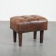 Beautiful sheepskin ottoman on high legs and beautiful warm colours