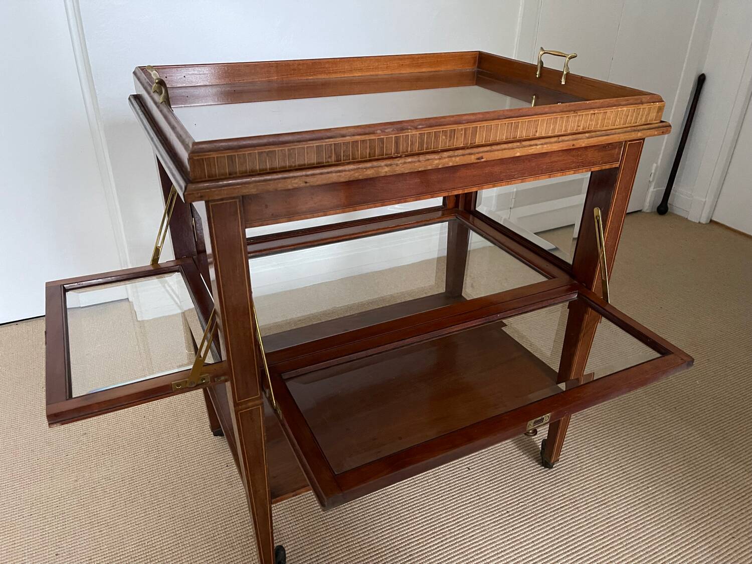 Serving Light mahogany English tea table. Beveled windows. circa 1900. Removable glass top.