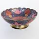 Vintage brass bowl with peacock motif, painted enamel, scalloped edge on a pedestal.
