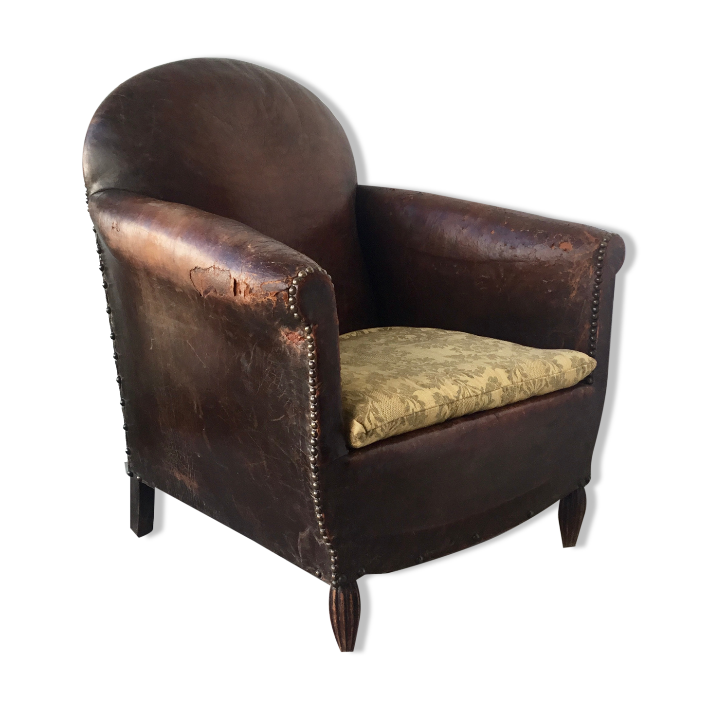 Club armchair in studded leather - early twentieth century
