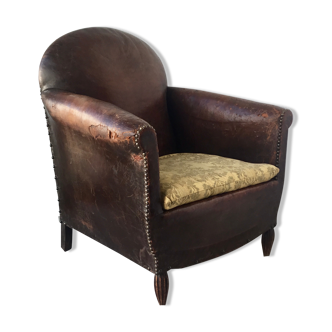 Club armchair in studded leather - early twentieth century