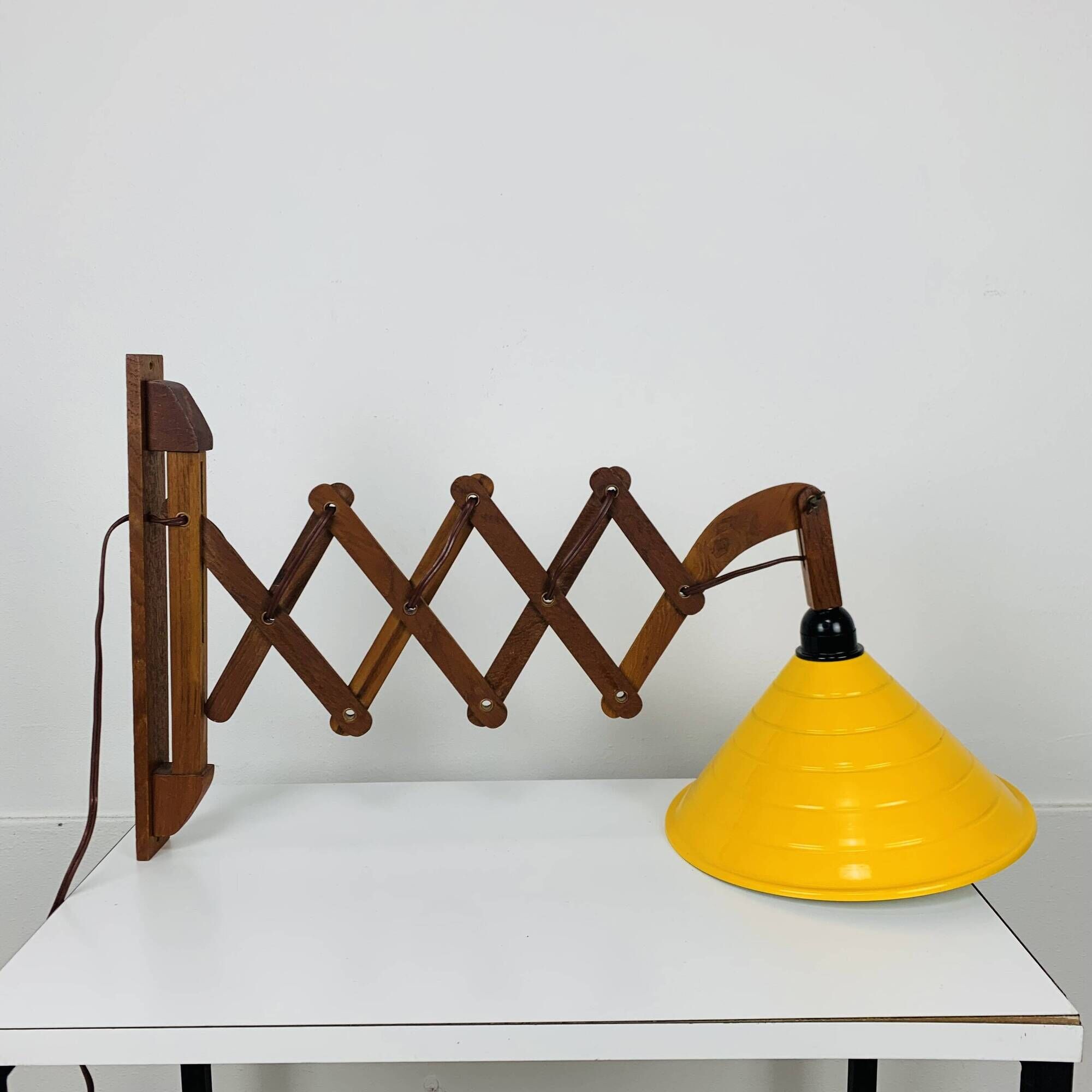Scandinavian accordion wall light from the 60s, wood and yellow reflector