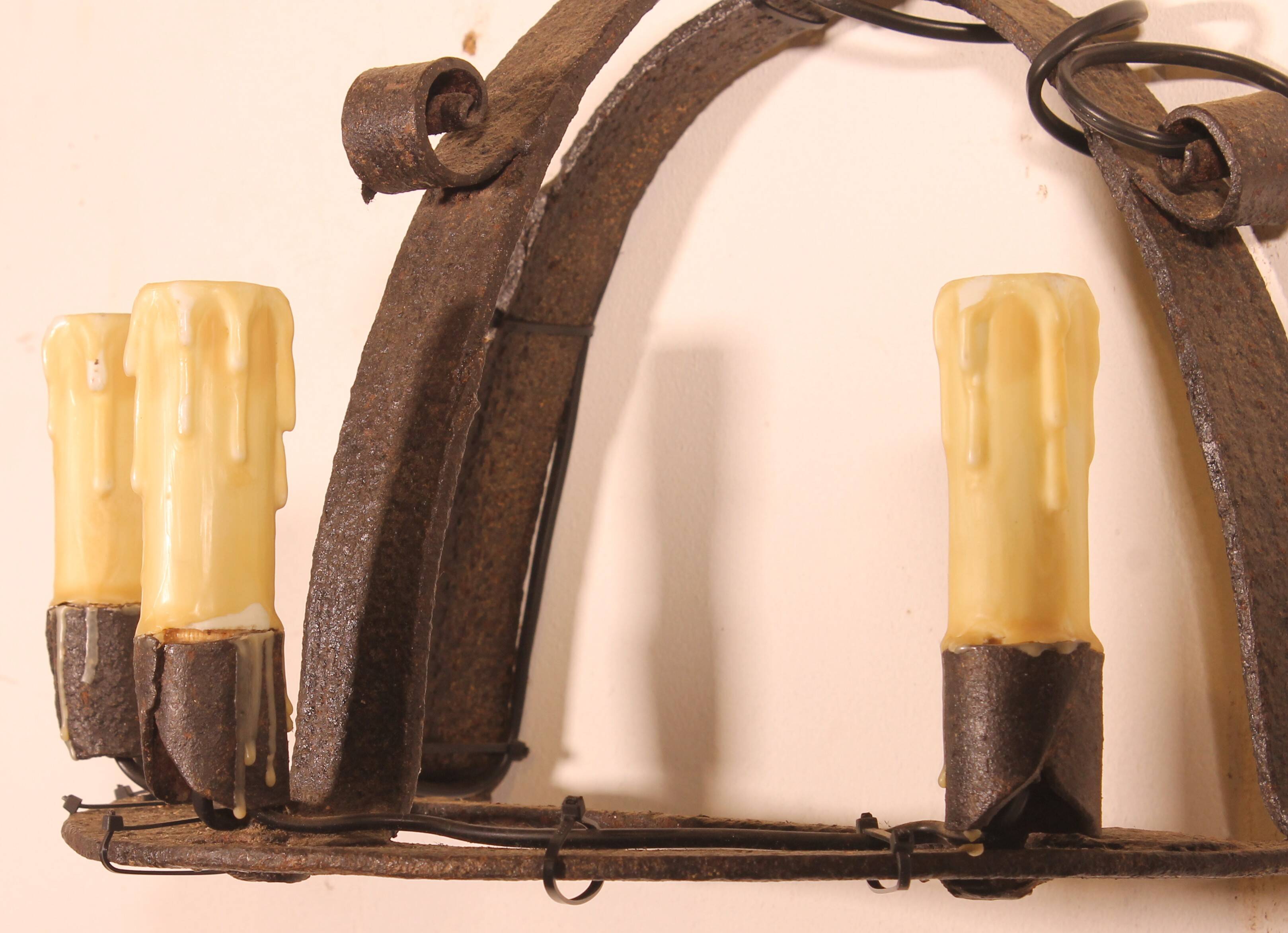 Pair of wrought iron wall sconces in medieval style