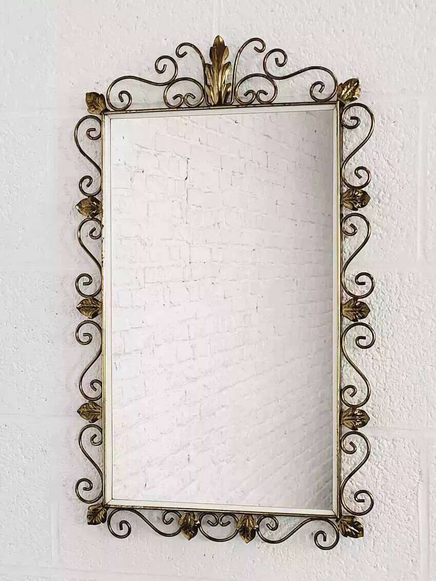 Rectangular mirror from the 1950s with a brass frame.