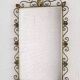 Rectangular mirror from the 1950s with a brass frame.