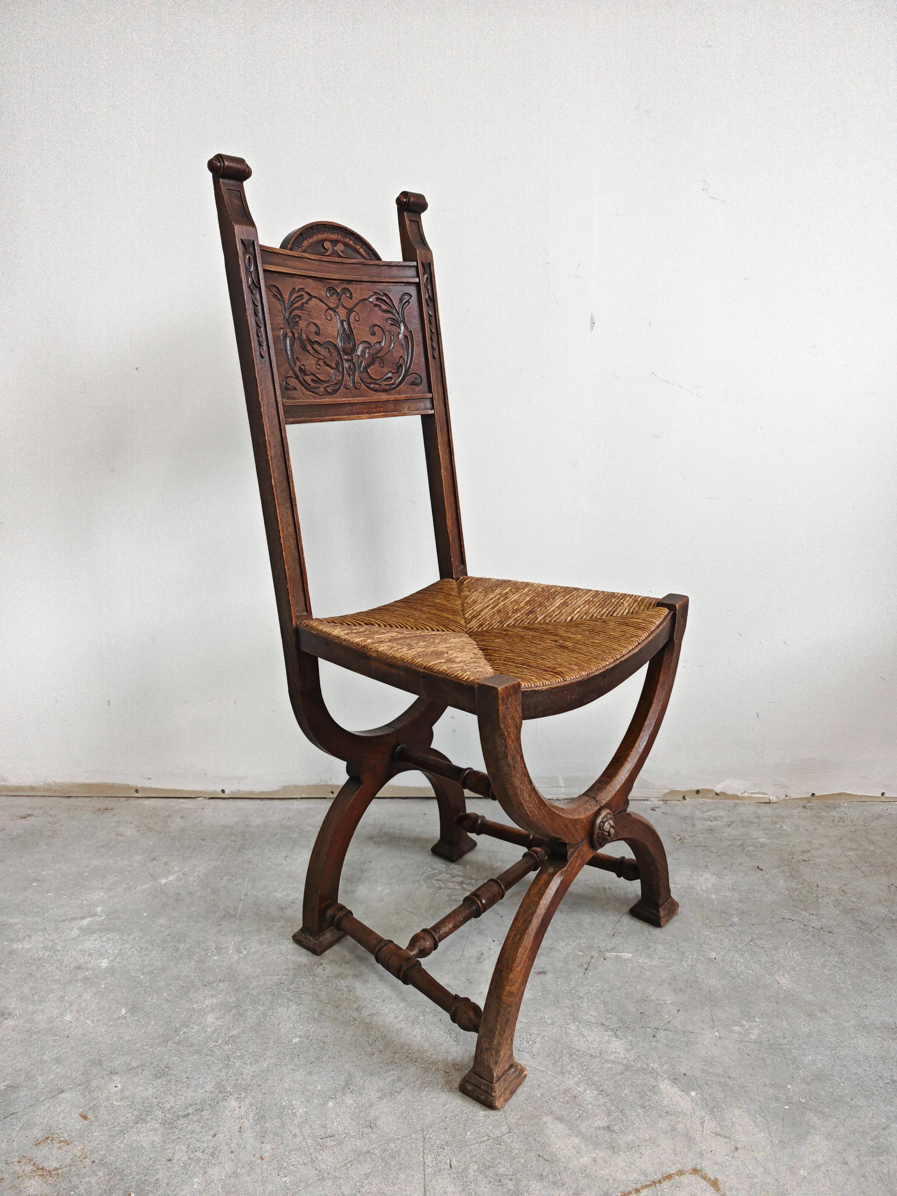 Pair of Neo-Renaissance oak chairs with straw seats, 1910