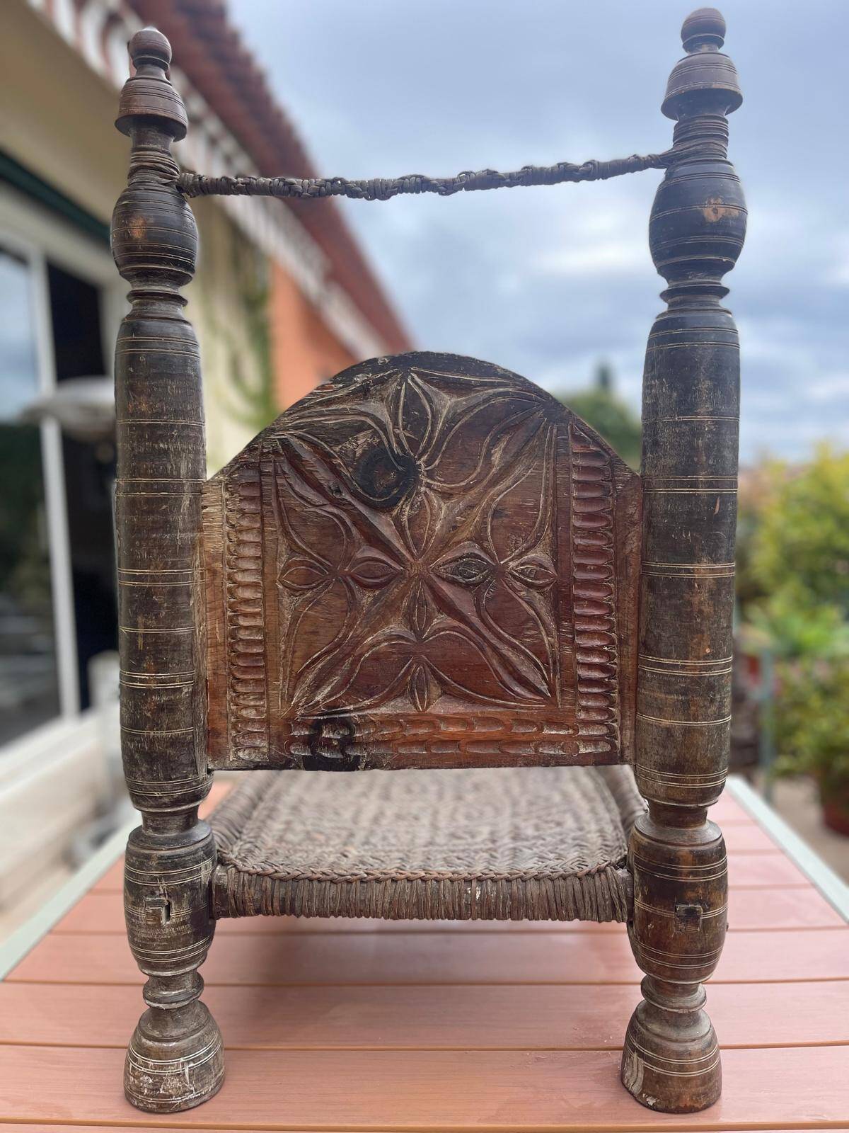 Pair of antique traditional Indian carved wooden chairs