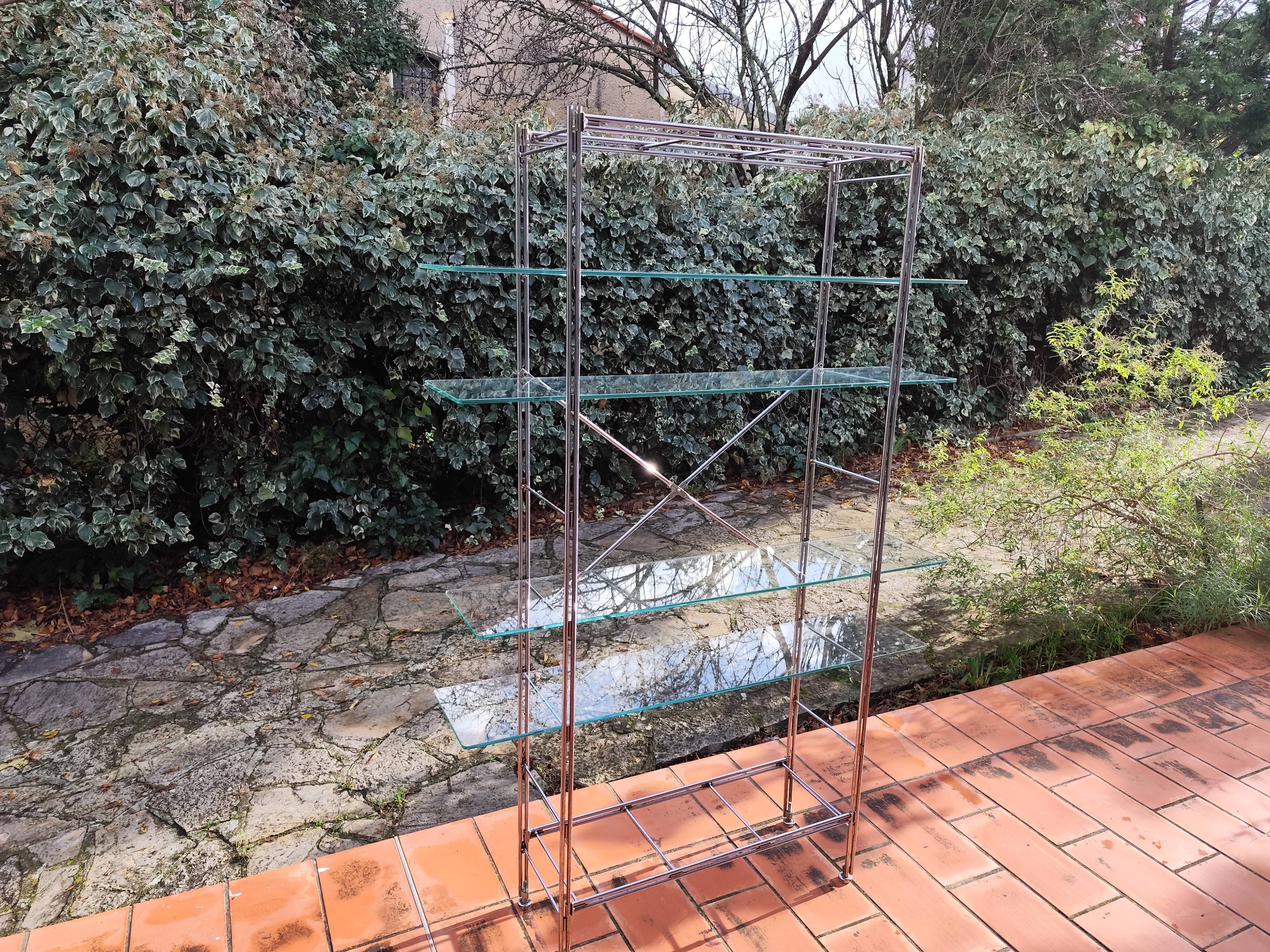 Modular metal chrome and vintage glass shelves from the 1970s.