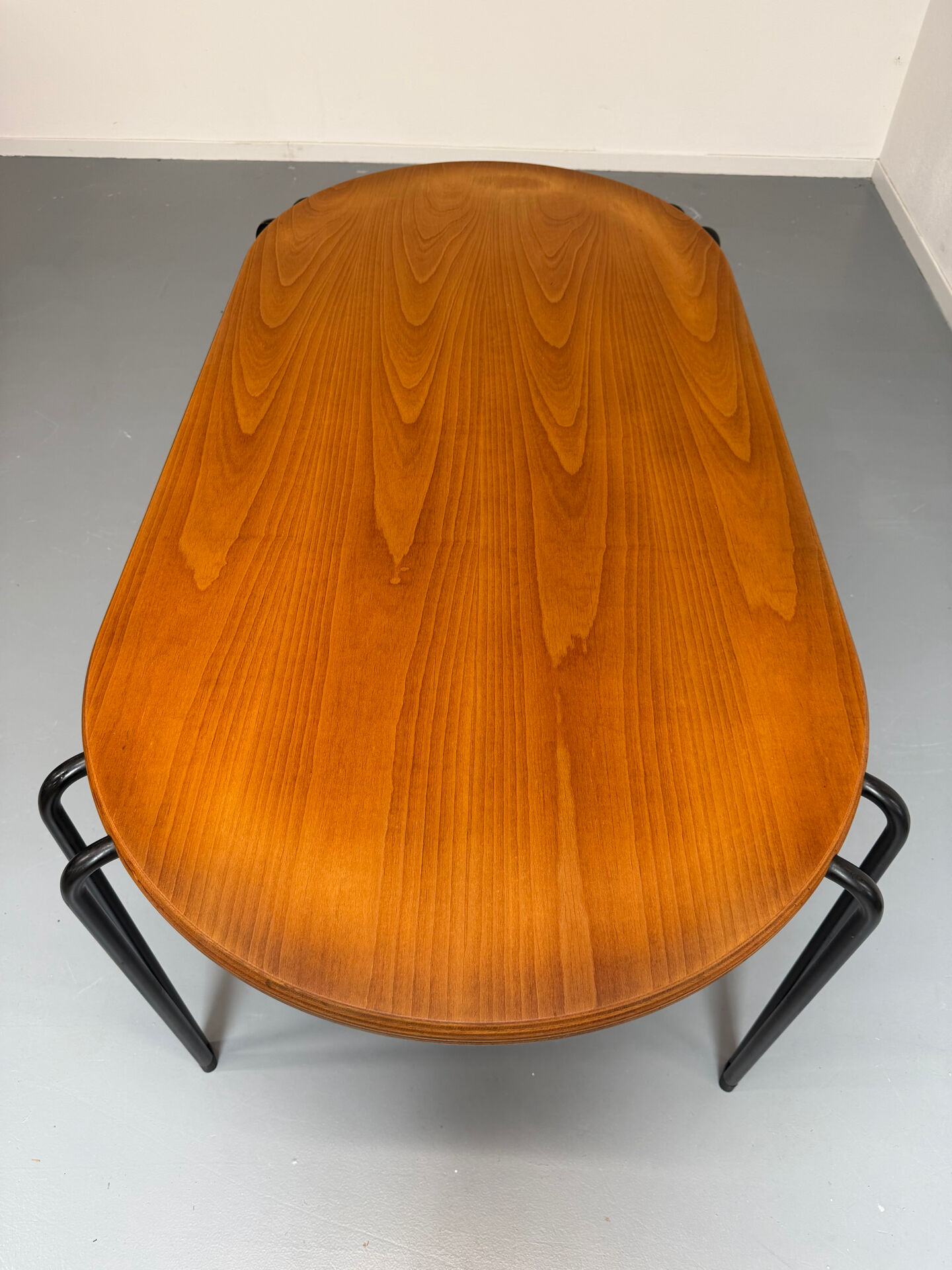 Solid wood dining table with tubular legs, 1980s postmodern design.