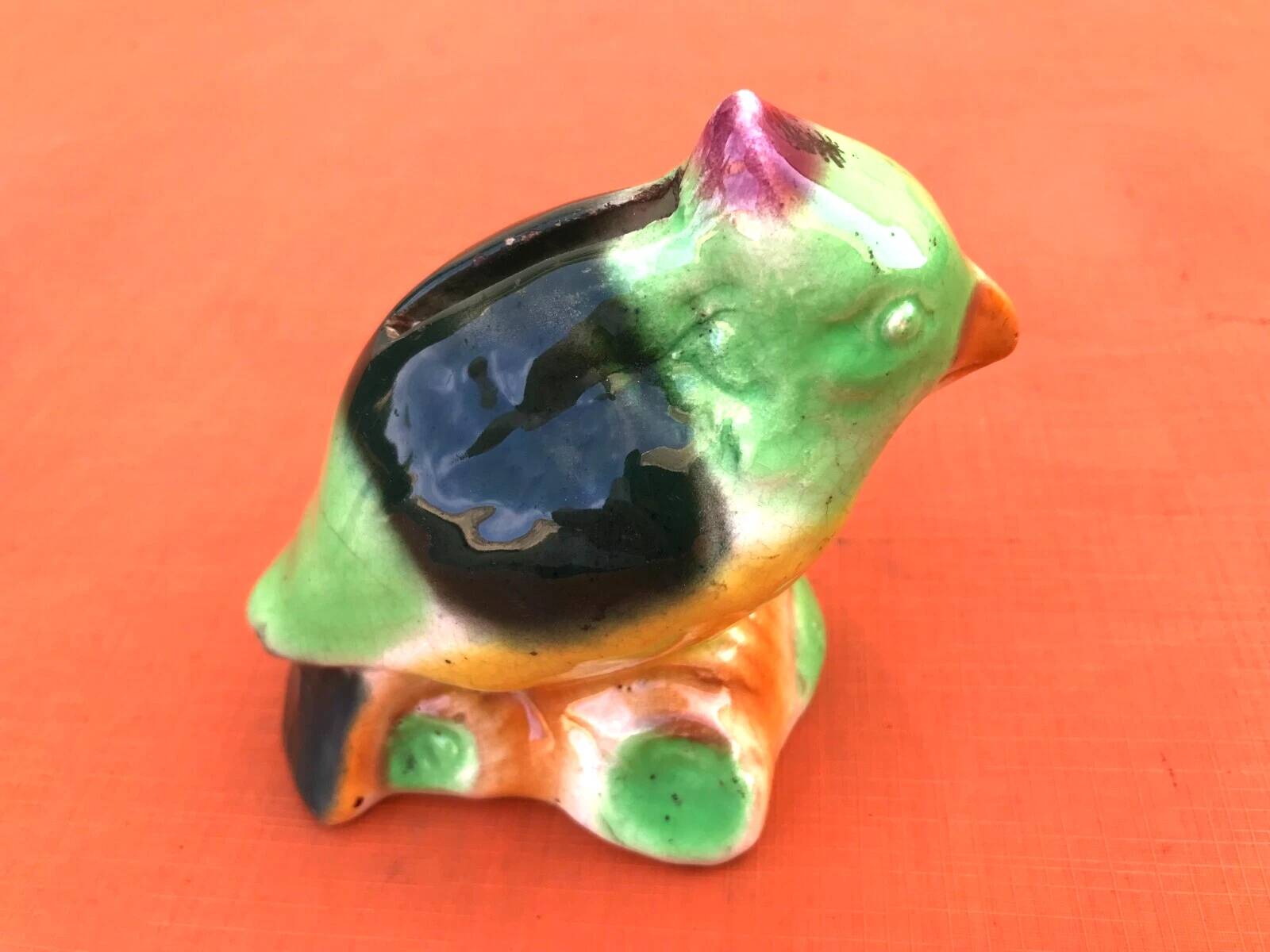 Polychrome ceramic parrot shape
