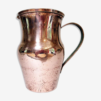 Old pitcher made of tinned copper